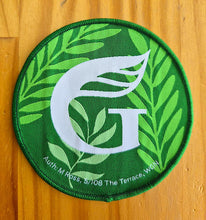 Green logo with leaves
